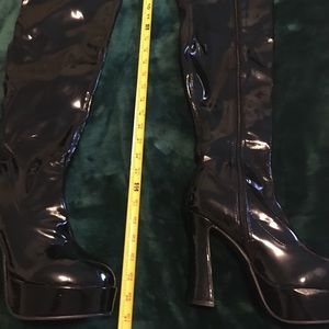 Shiny vinyl thigh high boots